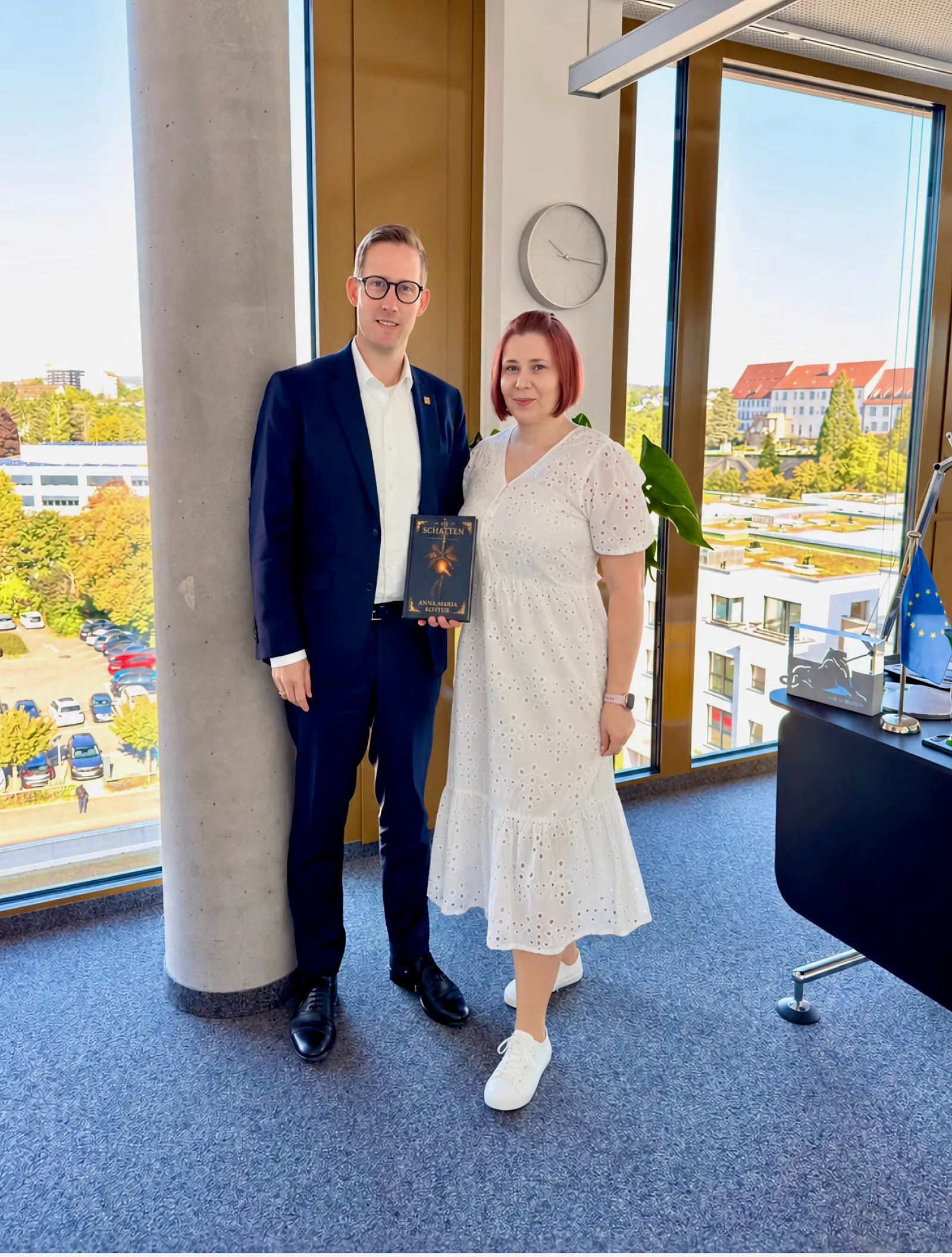 Lord Mayor Tobias Degode and Anna-Mariia Kostiuk at the town hall, with a view over the town’s rooftops